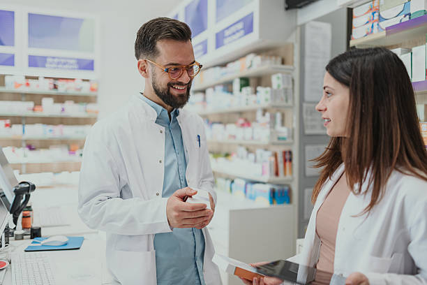 istock Pharmacists working together discussing medicine in pharmacy 2249648849