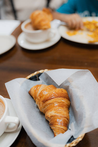 istock Croissant and hot chocolate on breakfast table 2249650078