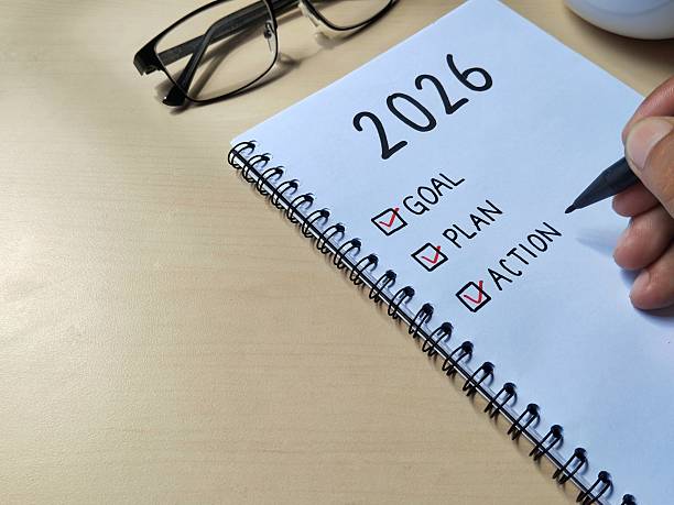 istock New year 2026 resolution concept written on a notebook with wooden table background 2249654285