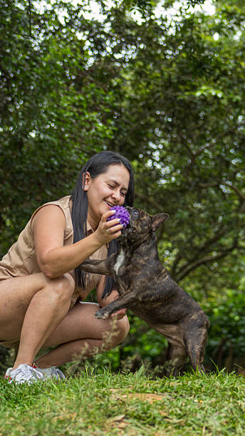 istock woman goes out for a walk with her dog 2249654396
