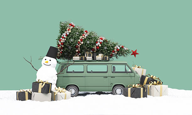 istock A green mini van with a decorated Christmas tree on top stands in snow, joined by a cheerful snowman and wrapped gift boxes, reflecting warm festive travel vibes. 3d rendering. 2249654495