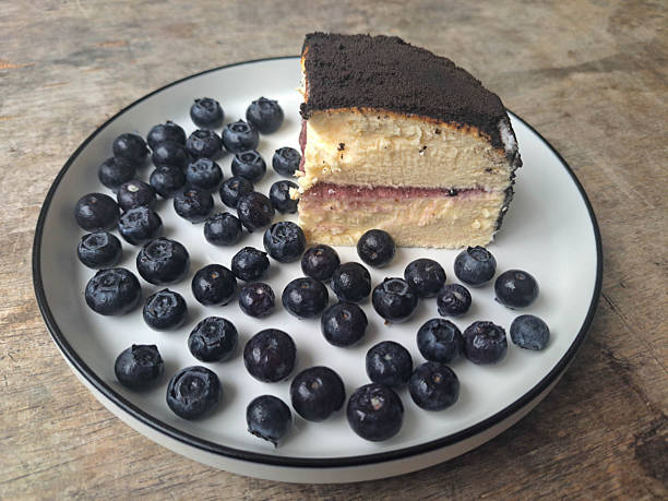 Delicious Blueberry Cheesecake with blueberries jam on a plate. Food Menu.