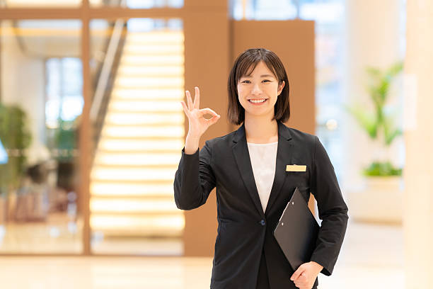 istock A female hotel attendant guiding a customer 2249657424