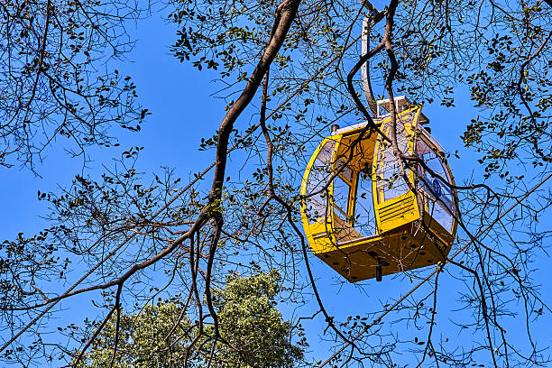Yellow overhead cable car cabin in the mountains