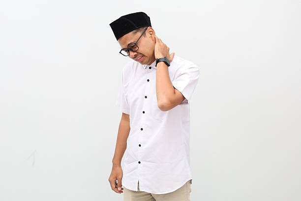 istock Asian muslim man suffering from neck pain. Isolated on white with copyspace 2249666458