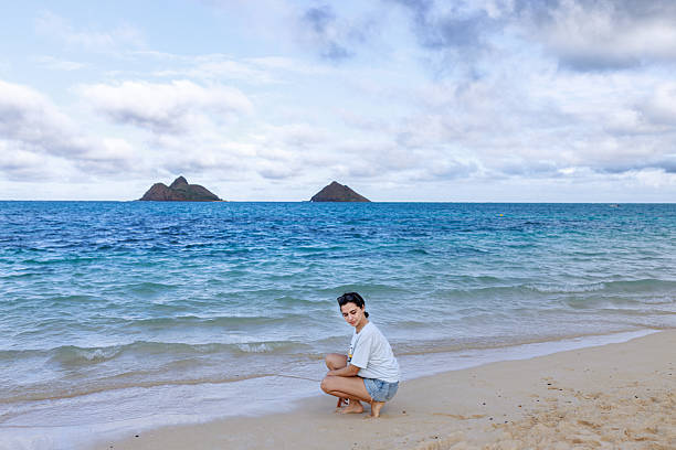 istock Woman Resting at Peaceful Tropical Beach 2249670144