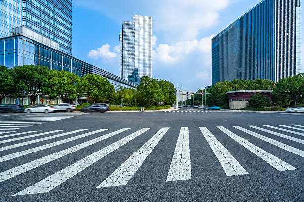 istock Empty road with zebra crossing and skyscrapers in modern city 2249672756