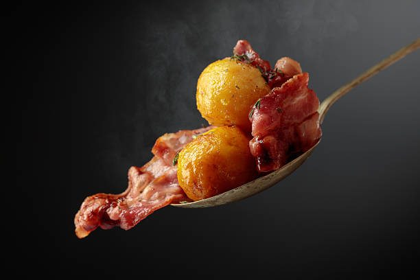 Pancetta near fully cooked and crisp