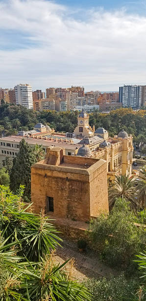 istock Cityscape with Historic Architecture and Greenery in Malaga, Spain. A panoramic elevated view combining ancient buildings, lush greenery, and modern urban structures. 2249673824