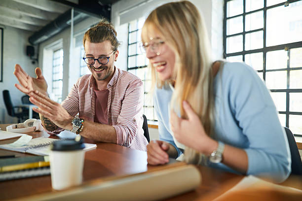 istock Cheerful freelancers having fun on a meeting at casual office. 2249676171