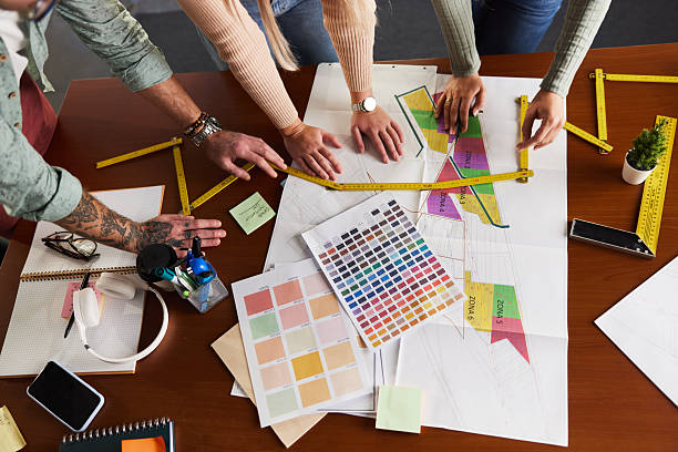 istock Above view of designers working on plans in the office. 2249676248