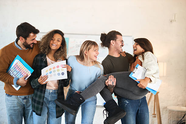 istock Cheerful creative team having fun at casual office. 2249676318