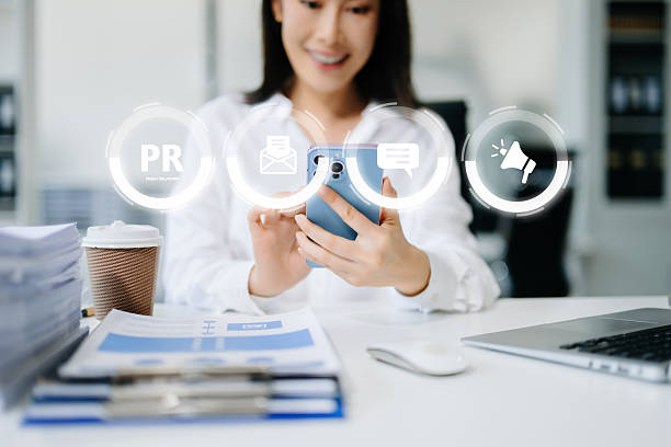 istock PR, Public relations concept. hands using laptop and tablet with public relations icon for communication advertising marketing strategy. with Ads and sales 2249676842