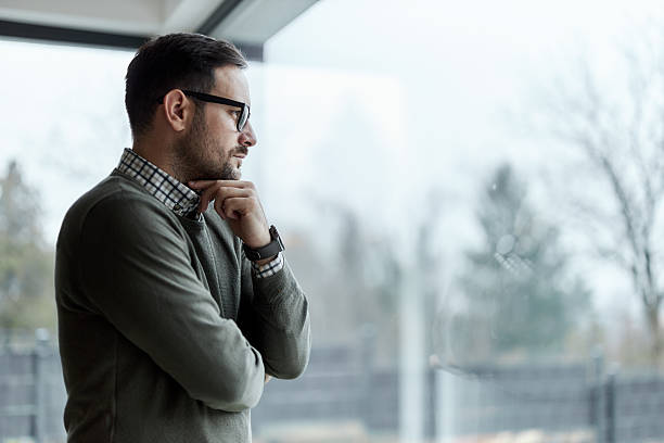 istock Thoughtful male entrepreneur standing by the window. 2249677207