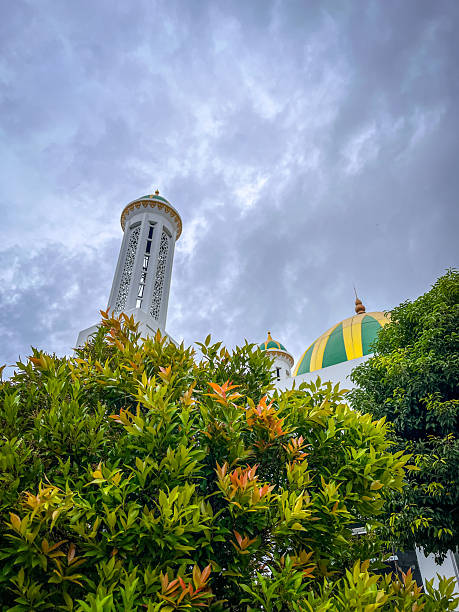 istock Minaret and Mosque Dome Against a Bright Blue Sky 2249677282