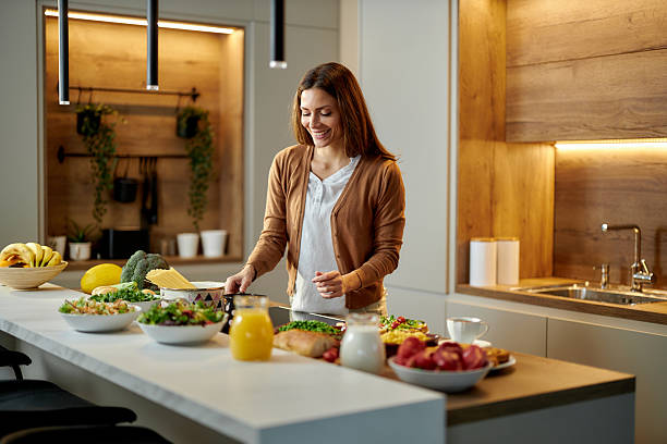 istock Happy woman preparing a drink in cezve at the kitchen. 2249677492