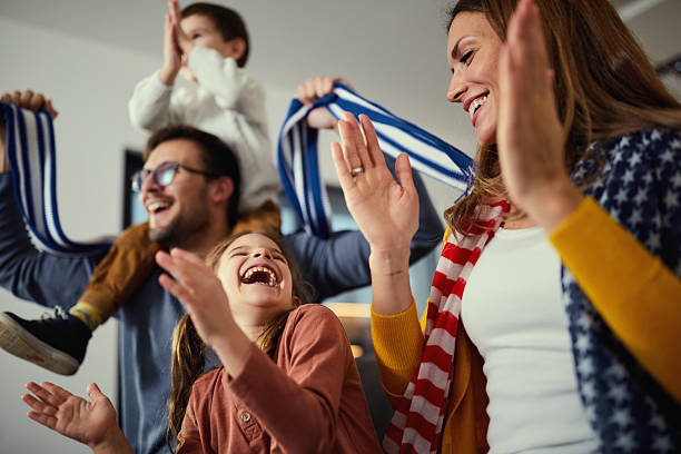 istock Applauding after successful sports match on TV! 2249677622