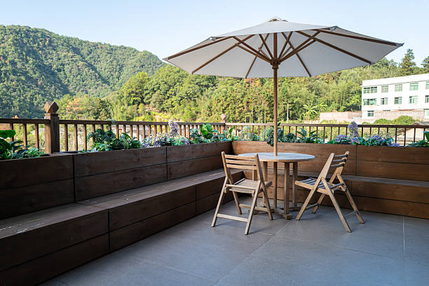 garden furniture. Wooden terrace with tables for outdoor dining. a dining room in a hotel or a summer cafe.