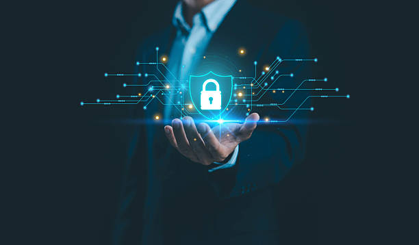 istock A businessman holding a glowing digital shield with lock icon and circuit lines, symbolizing cybersecurity, data protection, secure network infrastructure and advanced technology in modern business. 2249680074