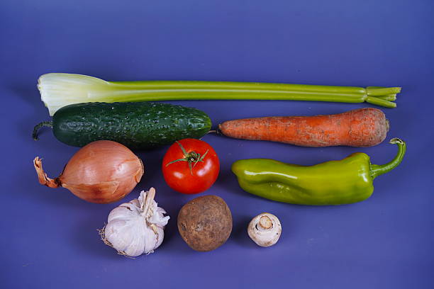 close up of vegetables on table and bowl in kitchen