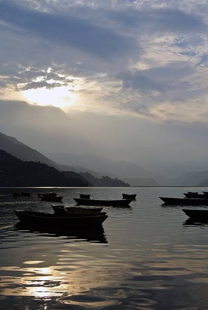 istock a tranquil lakeside scene at sunset or sunrise 2249683383