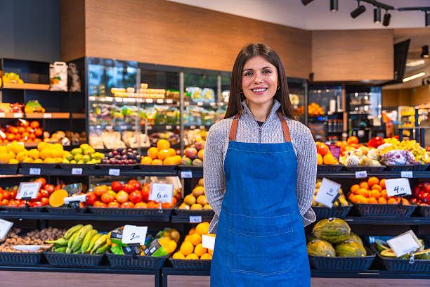 istock Smiling woman working at fruit and vegetable store 2249683761