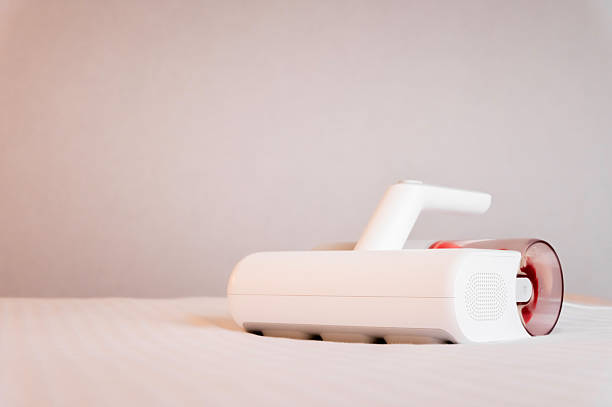 istock Remove dust mites from your mattress with a UV vacuum cleaner. Specialized vacuum cleaner for disinfection and cleaning of bed linen, mattresses and pillows 2249684937