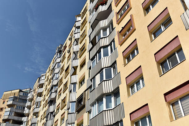 istock Typical facade of concrete panel building. Post Soviet flat of blocks 2249685646