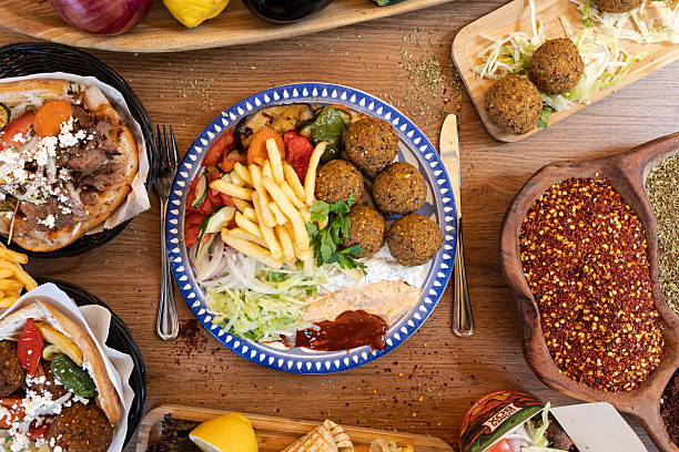 istock Middle eastern food platter with falafel, gyro, and fresh vegetables 2249686401