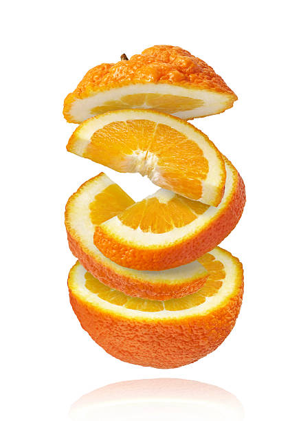 istock Fresh juicy orange slices floating on a white background. Creative citrus levitation concept for healthy food, summer vibes, advertising, packaging, and design projects. 2249686617