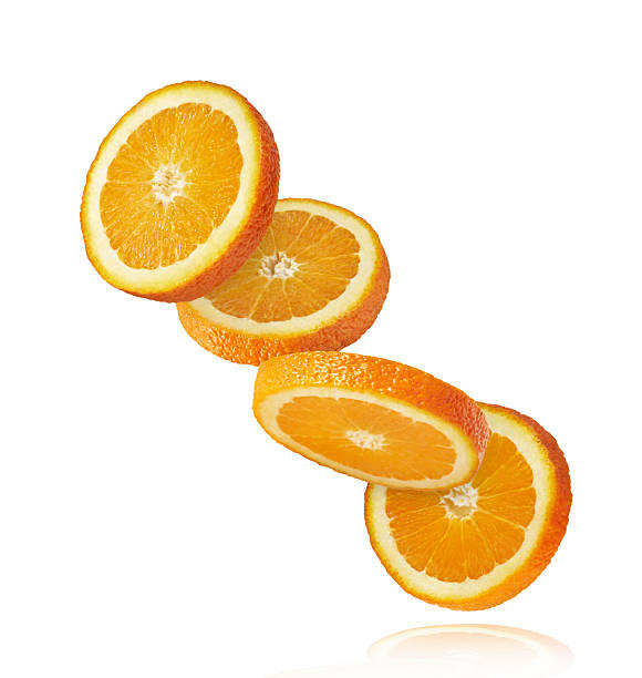istock Fresh juicy orange slices floating on a white background. Creative citrus levitation concept for healthy food, summer vibes, advertising, packaging, and design projects. 2249686620