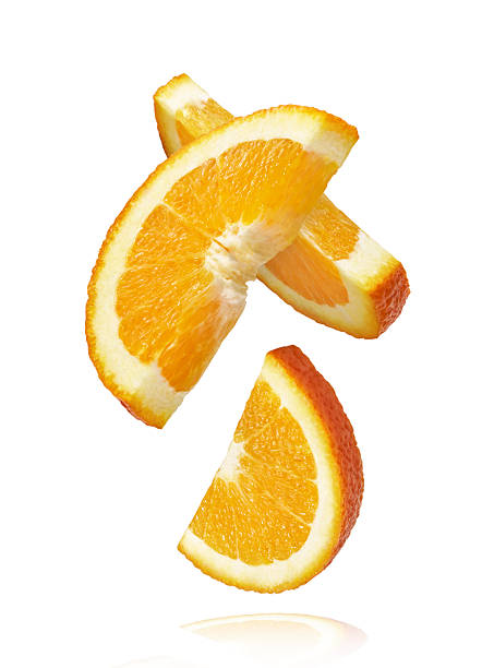 istock Fresh juicy orange slices floating on a white background. Creative citrus levitation concept for healthy food, summer vibes, advertising, packaging, and design projects. 2249686643