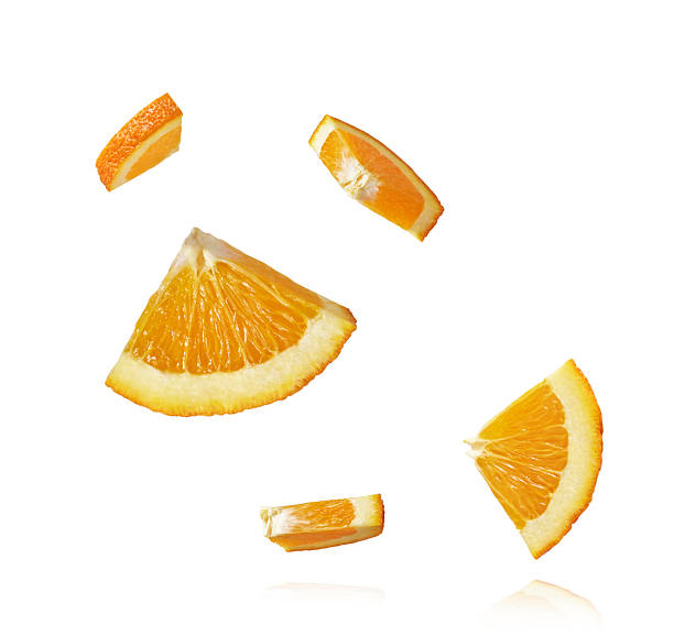 istock Fresh juicy orange slices floating on a white background. Creative citrus levitation concept for healthy food, summer vibes, advertising, packaging, and design projects. 2249686657
