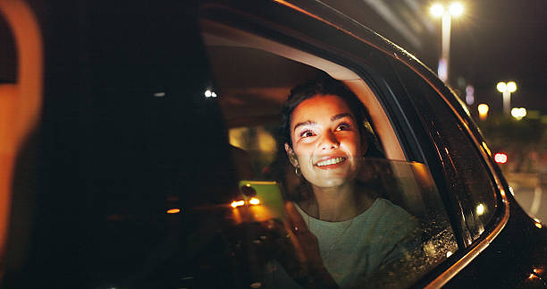 istock Night, thinking and happy woman in car with phone, transportation or remember memory by window. Dark city perspective, mobile or person admire town with bokeh, travel or taxi trip for reflection 2249686780