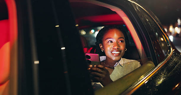 istock Night, thinking and happy woman by car window with cellphone, transportation or remember memory. Dark city perspective, mobile or black person with town admiration, travel or taxi trip for reflection 2249686808