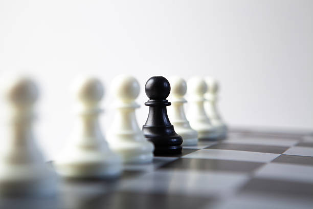 Black chess pawn stepping out from white pawn. Taking risk concept.