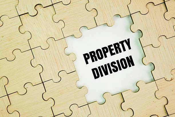 istock Wooden puzzle with the word Property division. 2249690445