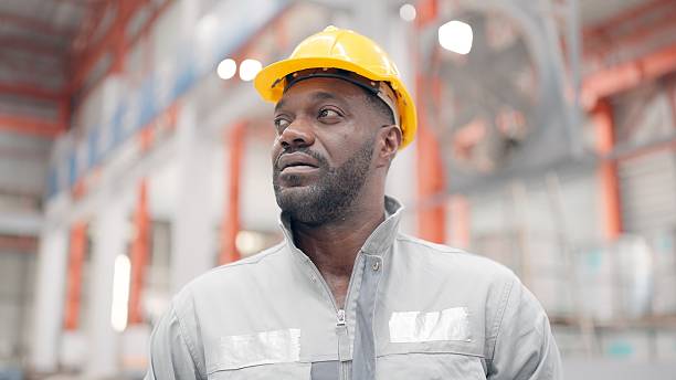istock Portrait of a male engineer or technicians professional with experience, expertise and technical, skills in their work in production line at industrial manufacturing, wearing uniforms and protective equipment to prepare for work in a factory. 2249690784
