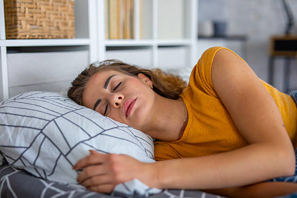 istock Peaceful woman sleeping in bed at night 2249691333