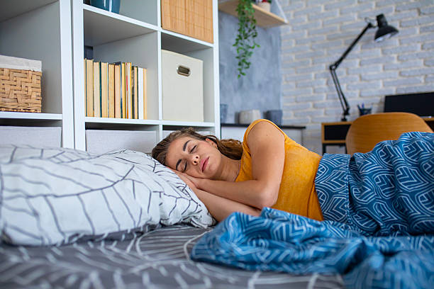 istock Peaceful woman sleeping in bed at night 2249691976