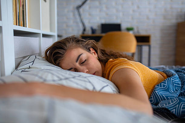 istock Peaceful woman sleeping in bed at night 2249692039