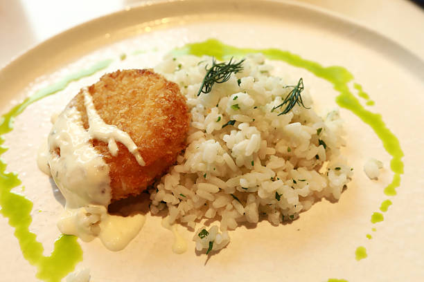 istock Crispy fried food with white sauce and rice 2249698526