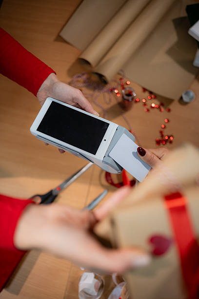 istock Customer paying for gift with credit card on pos terminal 2249699897