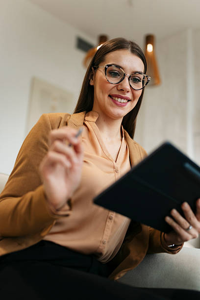 istock Businesswoman working on digital tablet in modern office 2249701245