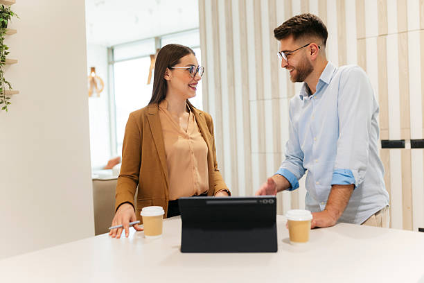 istock Colleagues collaborating on business project at modern office 2249701299