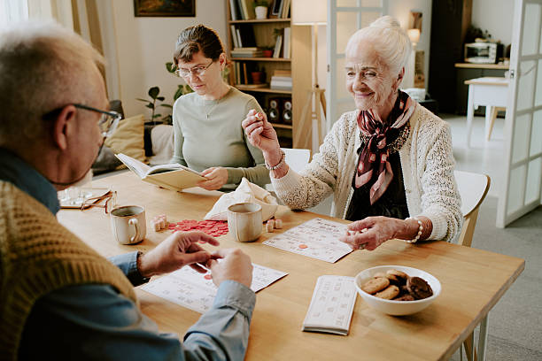 istock Senior Woman Playing Bingo with Senior Man at Table 2249705029