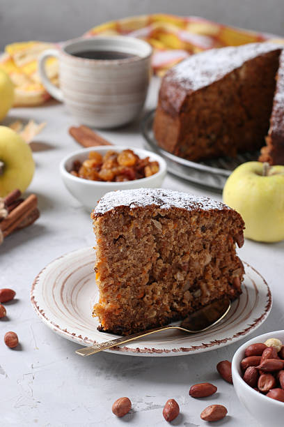 istock Homemade apple pie with cinnamon, raisins and peanuts, sprinkled with powdered sugar 2249706222