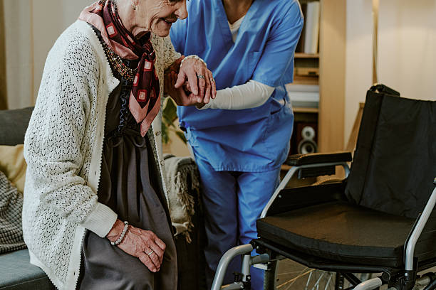 istock Senior Woman Receiving Assistance from Nurse with Disability Support 2249707228