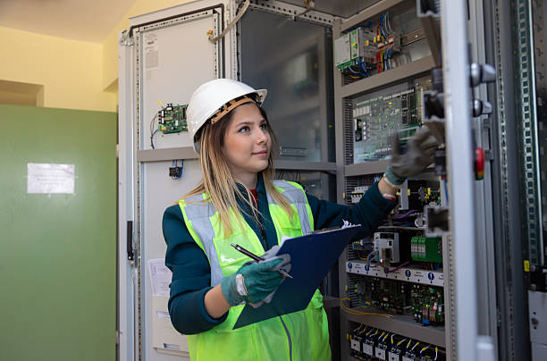 istock Female Engineer Performing Hands-On Inspection and Maintenance in Advanced Control Room of Renewable Energy Facility 2249707905
