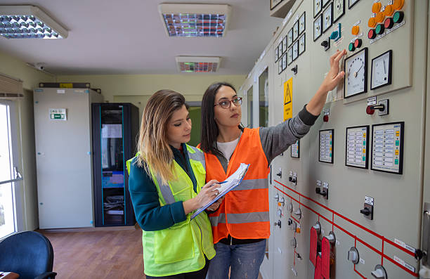 istock Two Female Engineers Collaborating on Technical Inspection in Control Room of Renewable Energy Facility 2249707923